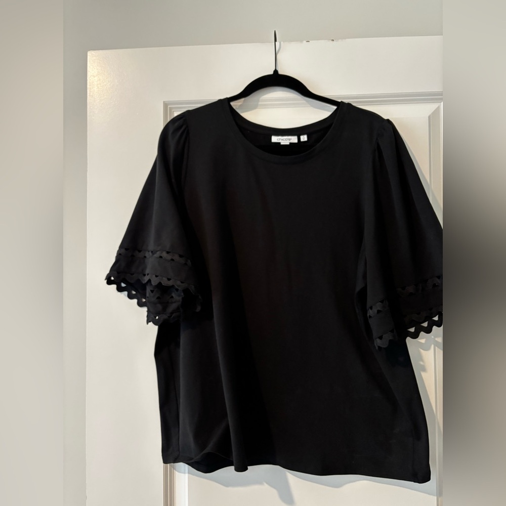 Chicos Black tee with detail sleeve.